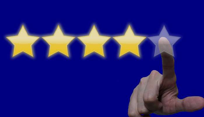 finger selecting stars to rate